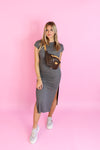 Rock the casual look with our Grey Short Sleeve Midi Dress. Featuring side slits and a comfortable fit, this dress is perfect for everyday wear. Stay chic and comfy all day long!