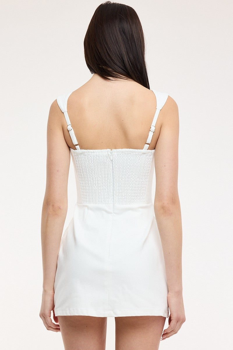 white mini dress with pockets Style:Zen Garden MINI DRESSES A stretchy smocked back denim mini dress