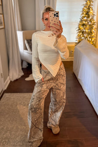 Ivory Asymmetrical Knit Top With Ring Detail