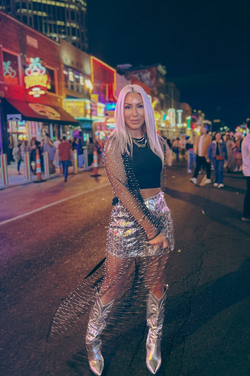 Be fashionably edgy in this black mesh cardigan! Featuring pearl and rhinestone mesh detailing and an ankle-length duster silhouette, it's perfect for adding a little boho glam flair to concerts, festivals, and beyond! Who knew being a trendsetter could be so easy (and so sparkly)?