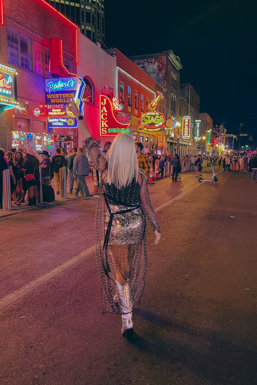 Be fashionably edgy in this black mesh cardigan! Featuring pearl and rhinestone mesh detailing and an ankle-length duster silhouette, it's perfect for adding a little boho glam flair to concerts, festivals, and beyond! Who knew being a trendsetter could be so easy (and so sparkly)?