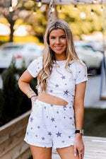 Soft lightweight white romper covered in trendy stars featuring elastic cutout waist. Perfect outfit for the 4th of July! Grey Star Cutout Side Romper - Find Cute Patriotic Outfits Online At Kendry Collection Boutique