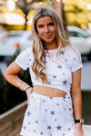 Soft lightweight white romper covered in trendy stars featuring elastic cutout waist. Perfect outfit for the 4th of July! Grey Star Cutout Side Romper - Find Cute Patriotic Outfits Online At Kendry Collection Boutique