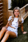 Soft lightweight white romper covered in trendy stars featuring elastic cutout waist. Perfect outfit for the 4th of July! Grey Star Cutout Side Romper - Find Cute Patriotic Outfits Online At Kendry Collection Boutique