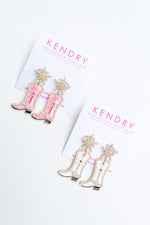 Our pearl and enamel cowgirl boot earrings are perfect for wearing to Nashville! 