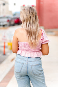 One shoulder puff sleeve smocked top featuring ruffle hem. Pair it with a trendy white skirt and you're ready to go! Pink Puff Sleeve Smocked Top - Shop Kendry Collection Boutique